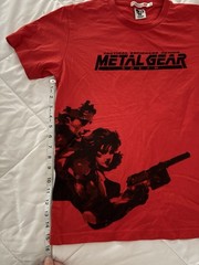 Metal Gear Solid collector lot with Uniqlo 25th Anniversary shirt