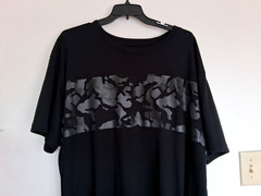 Men’s size 4XL black Tee w/ gray camouflage on front by Foundry. Excellent cond