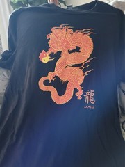 Black T Shirt With Red Dragon Design. 44″ Chest NEW. Maui (Hawaii) Under Dragon