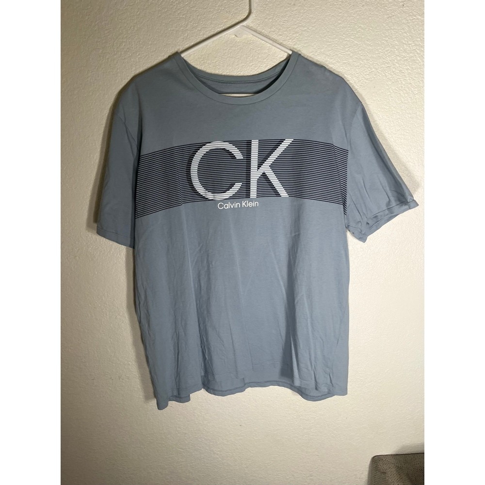 Calvin Klein XL blue T-Shirt w/graphic design-used good condition