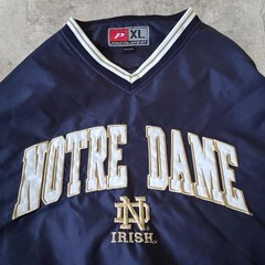90s vintage notre dame university windbreaker with an embroidered logo