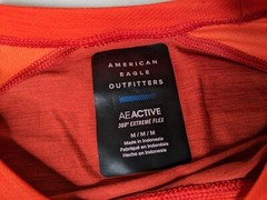 American Eagle Shirt Mens medium active wear red small hole back see photo