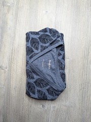 This blue Goodfellow & Co v-neck shirt features a dark leaf pattern.