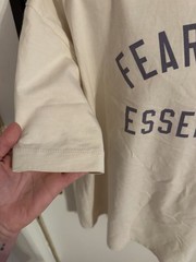 Fear of God Essentials oversized beige/tan graphic T-shirt front arch Logo Clean