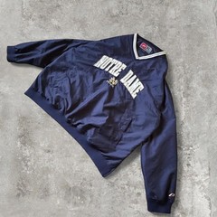 90s vintage notre dame university windbreaker with an embroidered logo