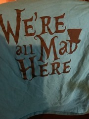 Alice in Wonderland- We’re All Mad Here -Cheshire Cat foil print giant L teal