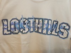 LOST HILLS LOGO FRONT AND MIRROR STYLE LOGO BACK WHITE MEN’S LG (OS) FIRE 🔥 🔥