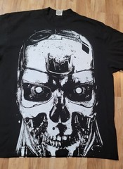 TERMINATOR JUMBO WHITE PRINT ON A SHAKA HEAVYWEIGHT GARMET DYED T SHIRT “MODERN”