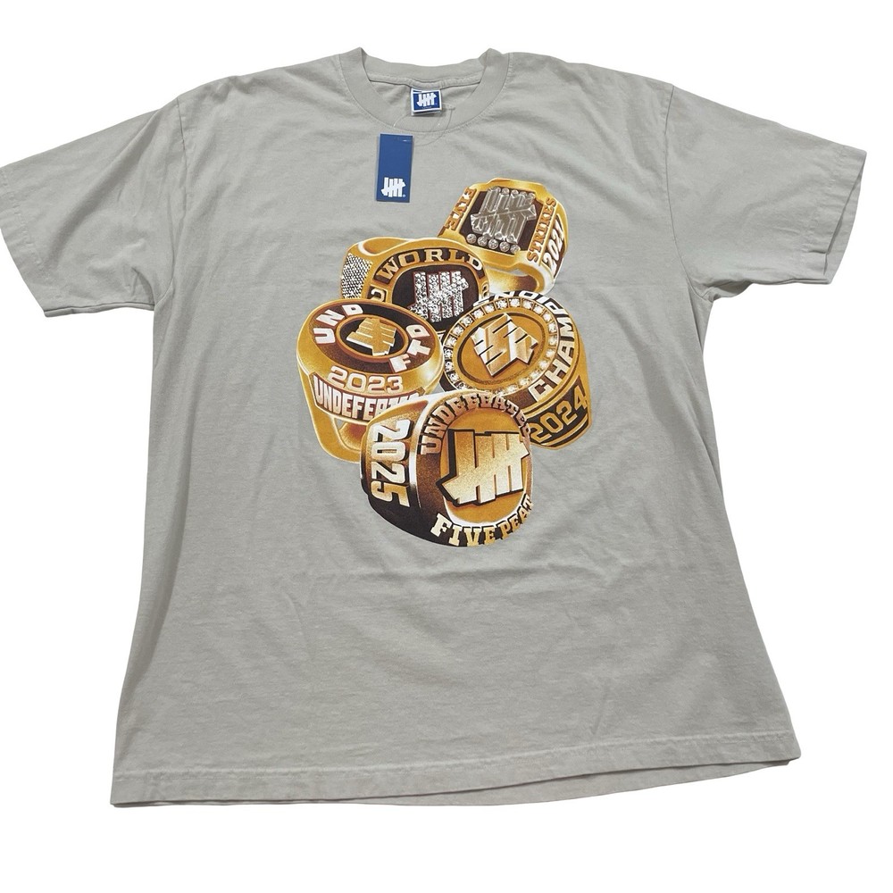 Undefeated Championship Rings S/S ‘23 ‘24 ‘25 Size L Beige Tee (Retail $45)