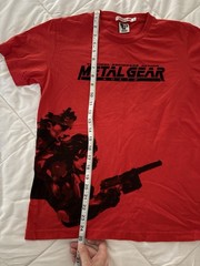 Metal Gear Solid collector lot with Uniqlo 25th Anniversary shirt