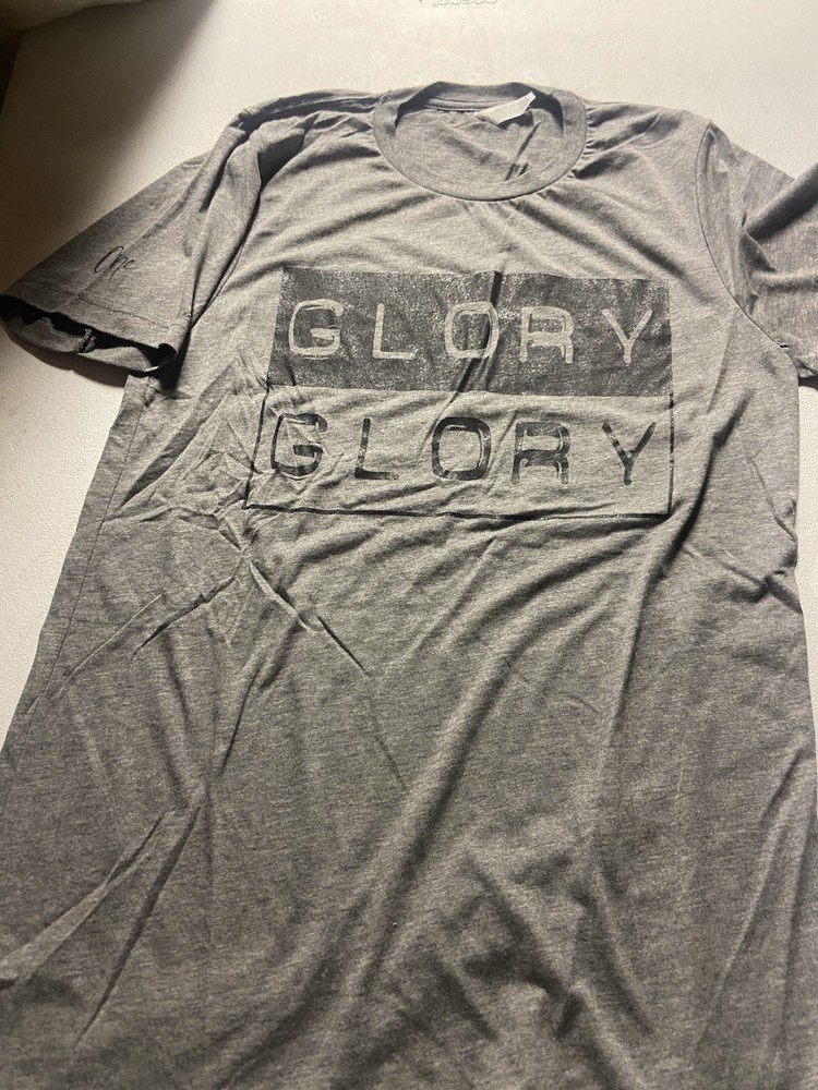 Light gray short sleeve t-shirt with Black “Glory, Glory” logo