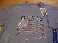 Orvis Classics “Fly Fish Flag” T-Shirt, NWT – Mens Medium (M) – Light Blue