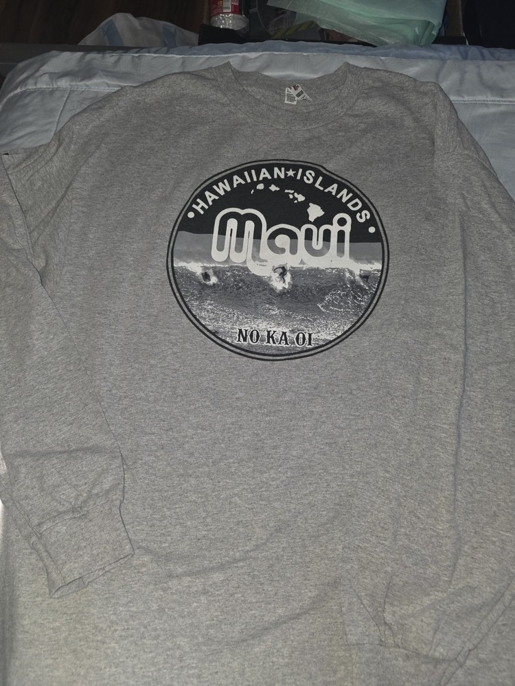 unisex long sleeve tee features a screen-printed “Maui No Ka Oi”