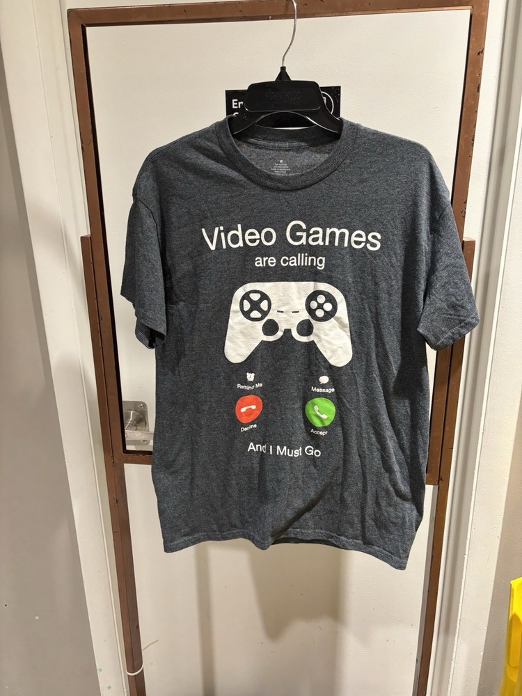 NWOT Funny video games are calling T-Shirt size medium. Short sleeve. 50/50