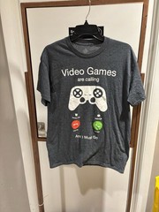 NWOT Funny video games are calling T-Shirt size medium. Short sleeve. 50/50