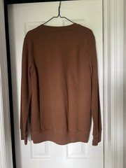 Hand screen printed crew neck “we rise by lifting others” brown medium