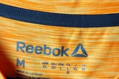 Vintage Reebok T Shirt Mens Size Medium Orange Reebok Logo On Front Made In USA
