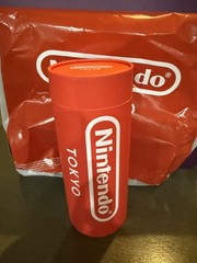 New + Sealed Official Nintendo TOKYO Store Red Cylinder Tube + T-Shirt (Size XL)