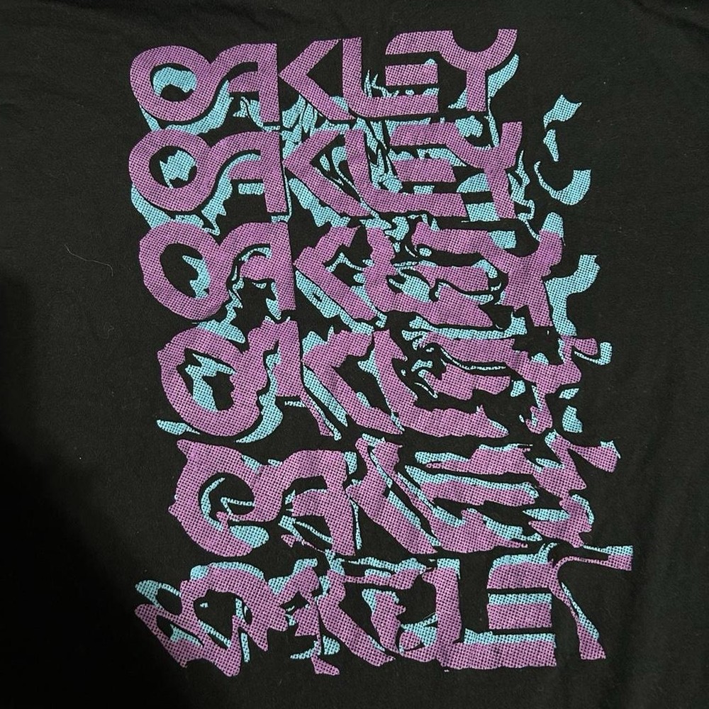 Oakley Black Short Sleeve T-shirt With Purple & Teal Graphic. Size Men’s L