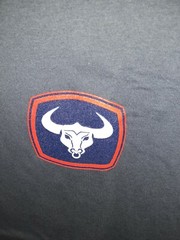 T-BONES STRONG (Plymouth MA Short Sleeve Next Level TShirt Soldier Blue Size M
