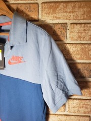New with tag! Tri tone color Small Nike Polo shirt Blues And Red.