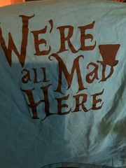 Alice in Wonderland- We’re All Mad Here -Cheshire Cat foil print giant L teal