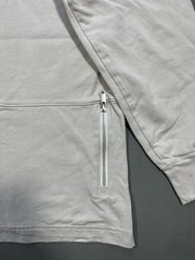 Nike long sleeve mock neck top in Light Bone featuring a small swoosh logo
