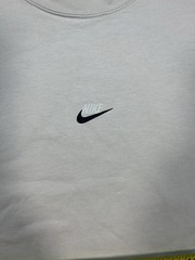 Nike long sleeve mock neck top in Light Bone featuring a small swoosh logo