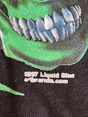 Vintage Liquid Blue Glow In Dark Skull Pile T-Shirt on Port & Co Blank 2007