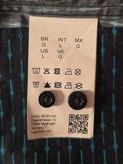 HUGO BOSS branded shirt featuring a distinctive all-over print in black and teal