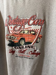 The T-shirt Is Typically Made From Cotton Or A Cotton Blend. Size Large