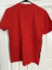 Metal Gear Solid collector lot with Uniqlo 25th Anniversary shirt
