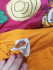 Vintage Lot Of 8 T-shirts Various Sizes Looney Tunes, NFL, Garfield, Ect.