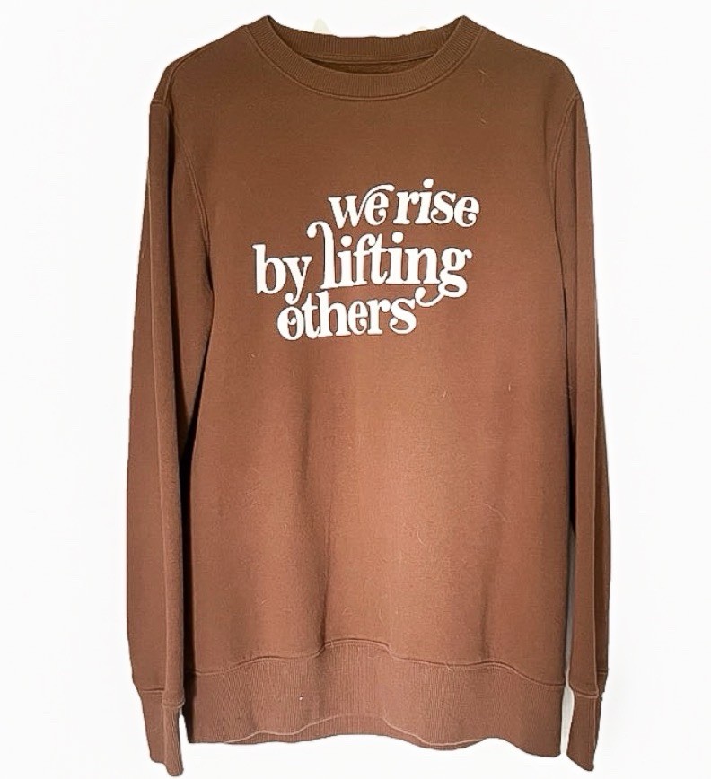 Hand screen printed crew neck “we rise by lifting others” brown medium