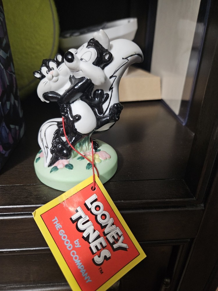 Pepe Le Pew Pursuing Penelope Pussycat Statue. Ceramic Heavy Duty Type Material