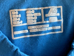 NB New Balance Stretch Blue Pocket T Shirt Unisex size Small Round Slit Hemline
