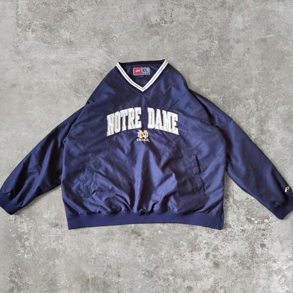 90s vintage notre dame university windbreaker with an embroidered logo