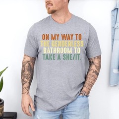 On My Way To The Genderless Bathroom To Take a She_It T-Shirt
