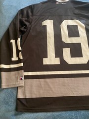 Champion #19 Champion Logo Hockey Jersey Sz L (44) (25in W X 30in L) Black