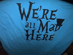 Alice in Wonderland- We’re All Mad Here -Cheshire Cat foil print giant L teal