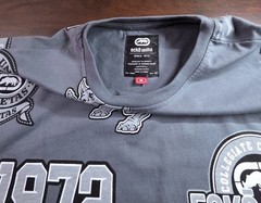 This is a grey Mens Ecko Unltd all-over print t-shirt Size Medium