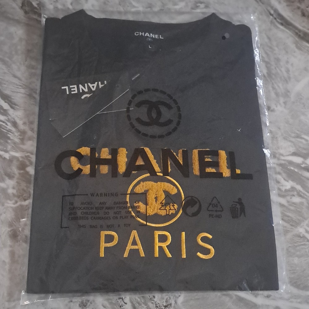 CHANEL Men’s Black Paris Logo Graphic Print Crew Neck Short Sleeve Knit Tee, L