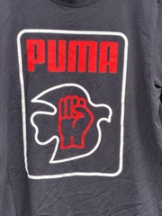 Puma x Lance Wyman Men’s Tee Shirt MEDIUM Power Through Peace Defenition Graphic