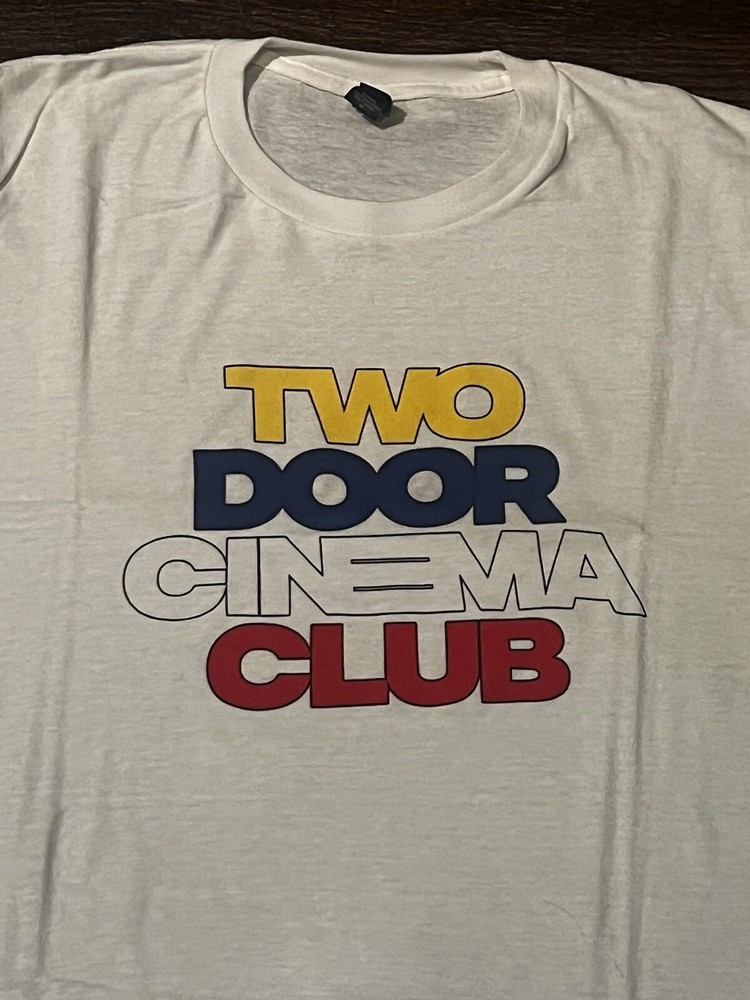 Brand New White Two Door Cinema False Alarm Tour concert shirt. Size M.