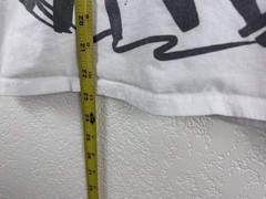 White graphic T-shirt featuring an abstract, hand-drawn fashion