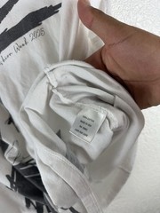 White graphic T-shirt featuring an abstract, hand-drawn fashion