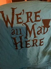 Alice in Wonderland- We’re All Mad Here -Cheshire Cat foil print giant L teal