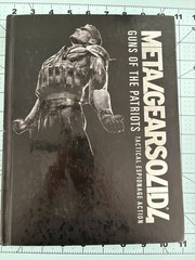 Metal Gear Solid collector lot with Uniqlo 25th Anniversary shirt