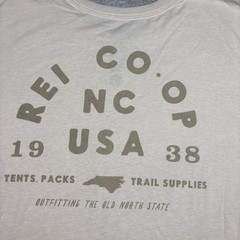 REI CO-OP flower graphic tan T shirt 1938 NC Outfitting the Old North State