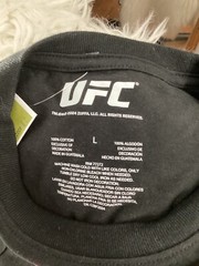 NWT UFC OFFICIAL LICENSED PRODUCT OCTAGON BLACK GRAFIC T SHIRT UNISEX IRREGULAR